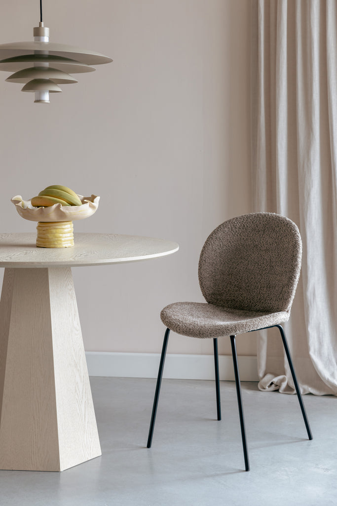  Bonnet chair with black metal frame, ribcord beige fabric with texture.