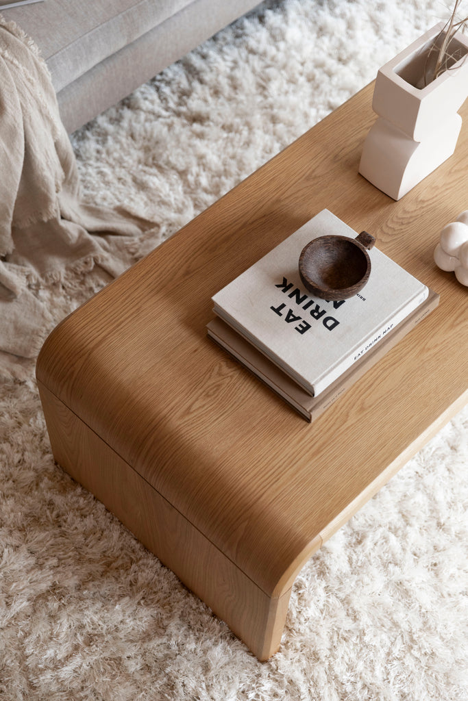 Wooden Coffee Table Brave  with books and ceramics.