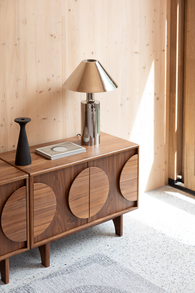 Sideboard Groove 2 Doors in Walnut colour at room setting with lamp and candle holder. 