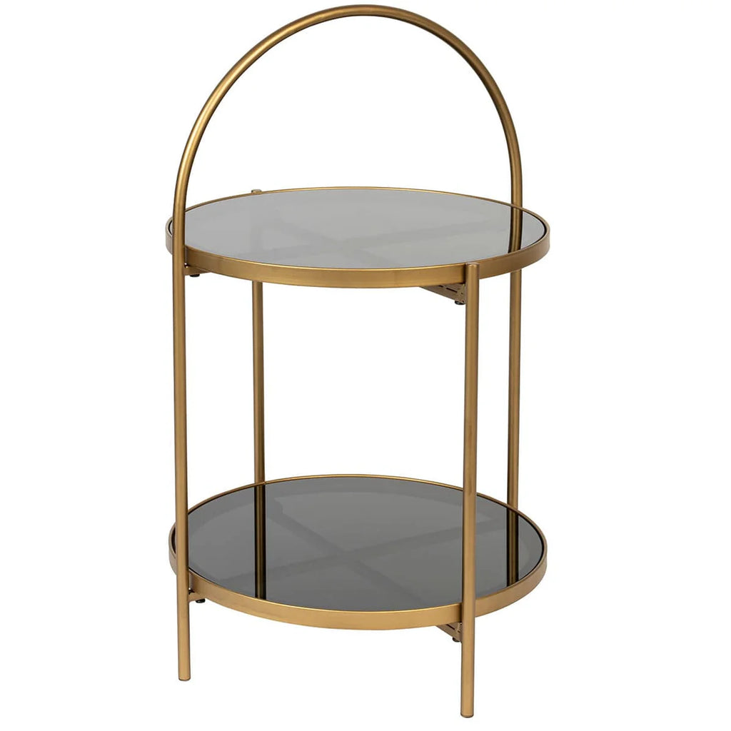 Introducing Side Table Calli a luxurious addition to your interior design. Made with an elegant, gold lustre iron frame and two tempered glass table tops, it adds a touch of glamour to any room. Use the curved handle to easily move it and save on floor space. Perfect for sipping cocktails next to an equally splendid accent chair.