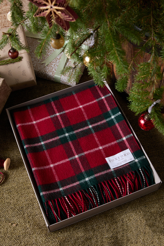 This luxurious throw is made from high-quality lambswool and features a classic check green pattern that adds an elegant touch to any space. It embodies sophistication and comfort, making it perfect for sleeping on chilly nights. You'll love wrapping yourself in it while enjoying your favourite book or sipping tea. This throw is crafted in our mill in County Mayo, a tradition we've upheld since 1892.