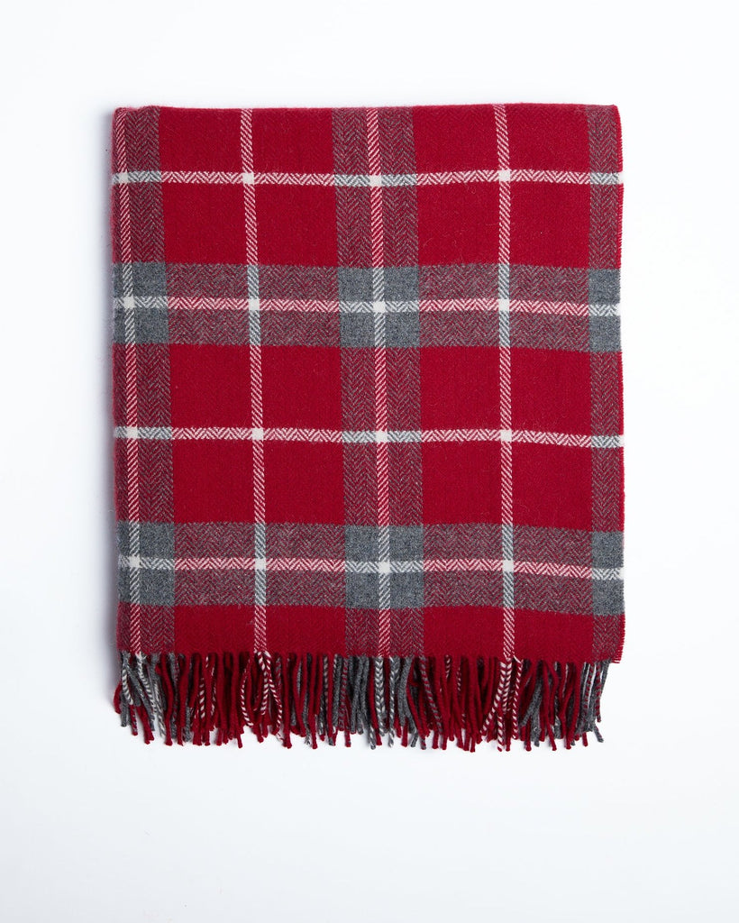 This luxurious throw is made from high-quality lambswool and features a classic check-grey pattern that adds an elegant touch to any space. It embodies sophistication and comfort, making it perfect for sleeping on chilly nights. You'll love wrapping yourself in it while enjoying your favourite book or sipping tea. This throw is crafted in our mill in County Mayo, a tradition we've upheld since 1892.