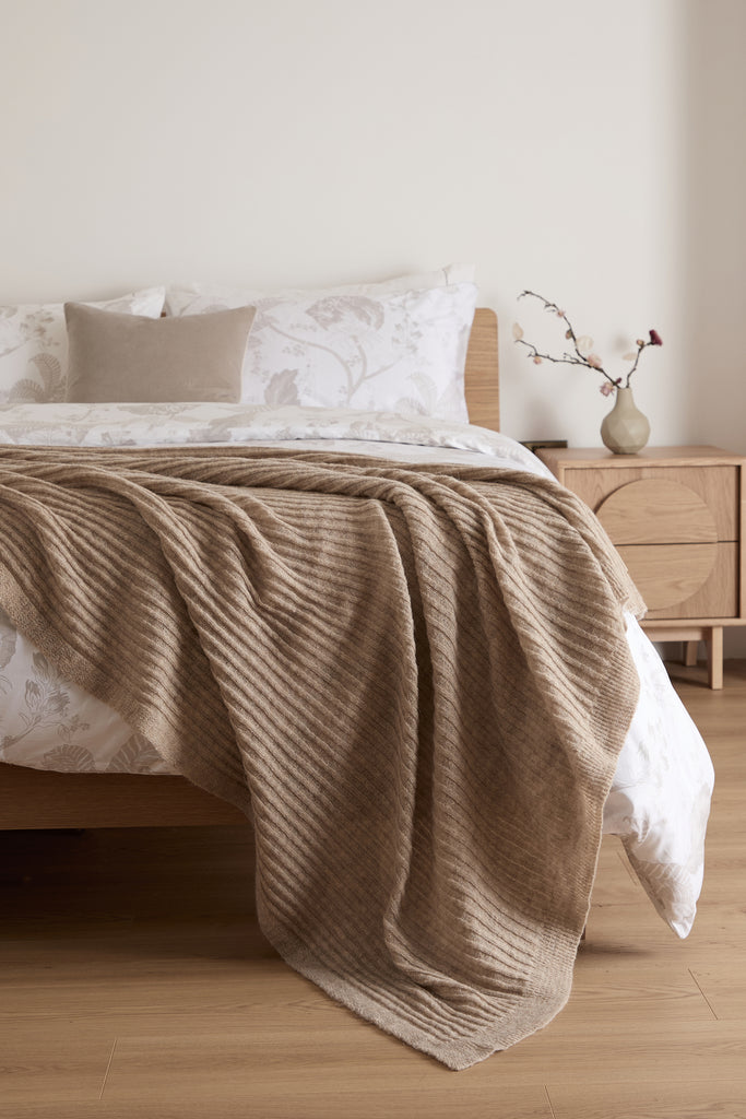 Beige knitted bed blanket, 150x200cm, mohair blend, ribbed texture, designed in Ireland, woven in Portugal.