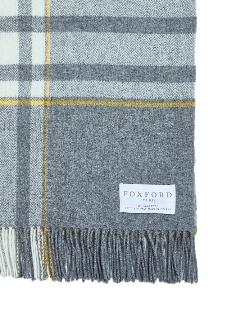 Designed and expertly woven at our mill, the Liath Lambswool Comfort Throw is a contemporary take on a traditional style.

Made using 100% lambswool in a soft grey, white and yellow palette.

Our comfort throws are a slightly smaller version of our bestselling standard throws – ideal for cosying up on the sofa or draping over the back of your favourite armchair.