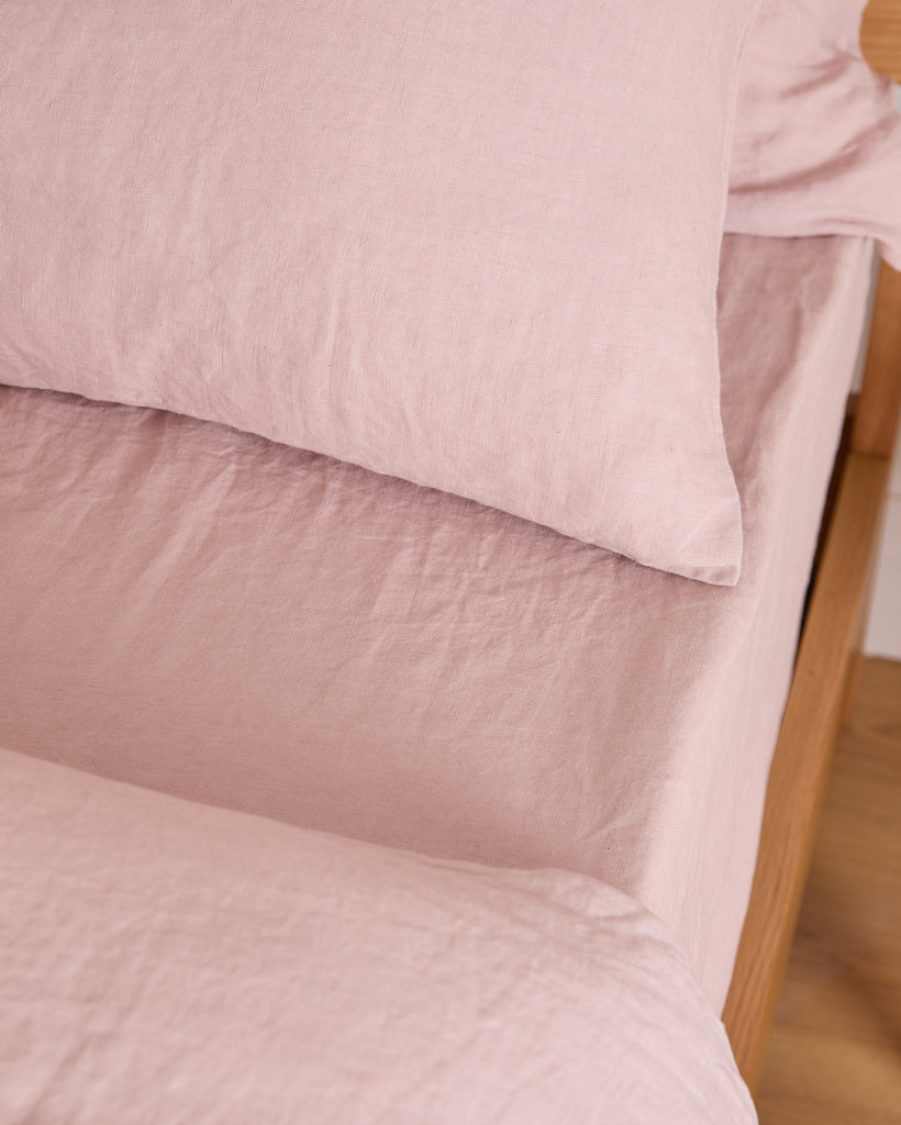 The Foxford Blush Pure Linen Fitted Sheet adds a touch of elegance and comfort to your bed. Crafted from 100% premium linen, it provides exceptional softness, breathability, and durability. The soft blush hue brings warmth and a subtle, sophisticated tone to your bedroom décor. Pre-washed for a relaxed, lived-in feel, it becomes even softer with each use. Naturally temperature-regulating and antibacterial, this fitted sheet is perfect for year-round comfort. Enhance your bedding with this luxurious and time