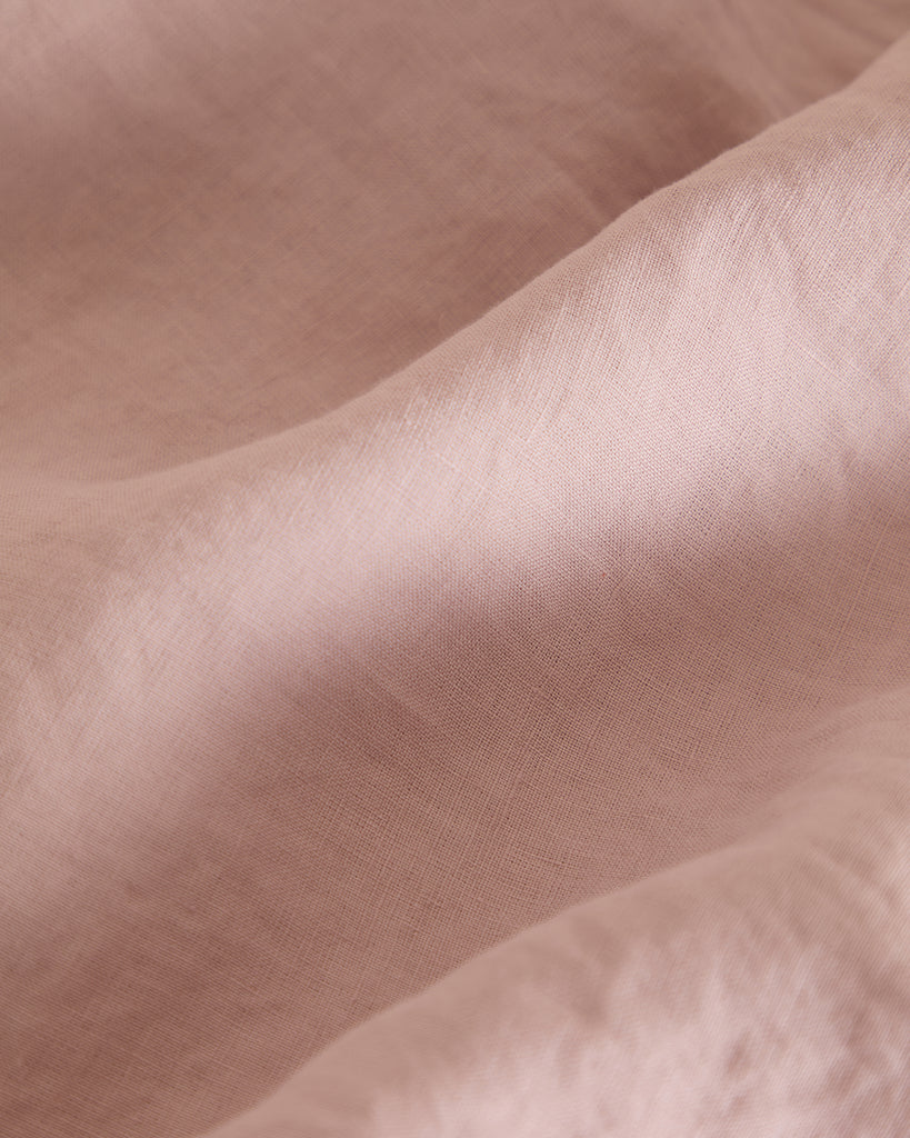 The Foxford Blush Pure Linen Fitted Sheet adds a touch of elegance and comfort to your bed. Crafted from 100% premium linen, it provides exceptional softness, breathability, and durability. The soft blush hue brings warmth and a subtle, sophisticated tone to your bedroom décor. Pre-washed for a relaxed, lived-in feel, it becomes even softer with each use. Naturally temperature-regulating and antibacterial, this fitted sheet is perfect for year-round comfort. Enhance your bedding with this luxurious and time