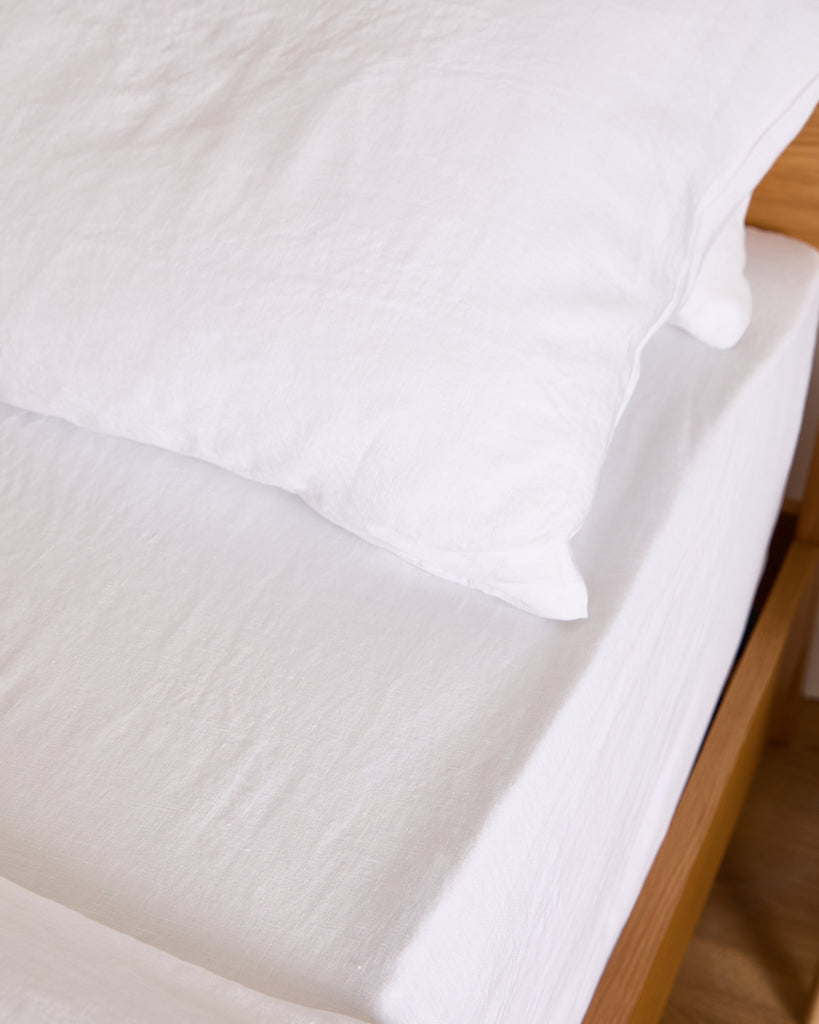 Crafted from 100% premium linen, the Foxford White Pure Linen Fitted Sheet brings a restful touch to your bedroom. Its exceptional softness, breathability, and durability create a peaceful atmosphere. The crisp white color adds a light and airy feel to your decor. Pre-washed for a soft, lived-in comfort that only improves with time. Its natural temperature-regulating and antibacterial properties make it a perfect choice for year-round comfort. Elevate your bedding with this timeless and luxurious essential.