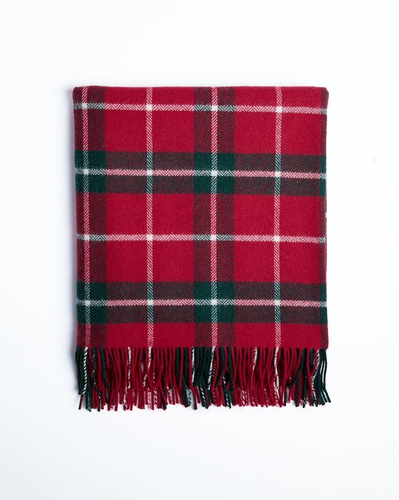 This luxurious throw is made from high-quality lambswool and features a classic check green pattern that adds an elegant touch to any space. It embodies sophistication and comfort, making it perfect for sleeping on chilly nights. You'll love wrapping yourself in it while enjoying your favourite book or sipping tea. This throw is crafted in our mill in County Mayo, a tradition we've upheld since 1892.