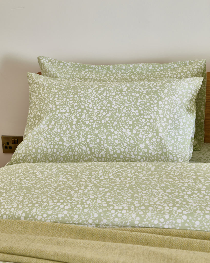 Complete your bedroom with the Foxford Lucy Pillowcase Set in a serene sage green floral design. Part of our SS25 Everyday Collection, these pillowcases are crafted with a soft 180-thread count for everyday comfort and timeless style. Designed in Ireland with a focus on quality and attention to detail, the Lucy Pillowcase Set perfectly complements the matching duvet and fitted sheet. Bring a touch of nature and effortless elegance to your home with this beautifully crafted set, perfect for enhancing any bed