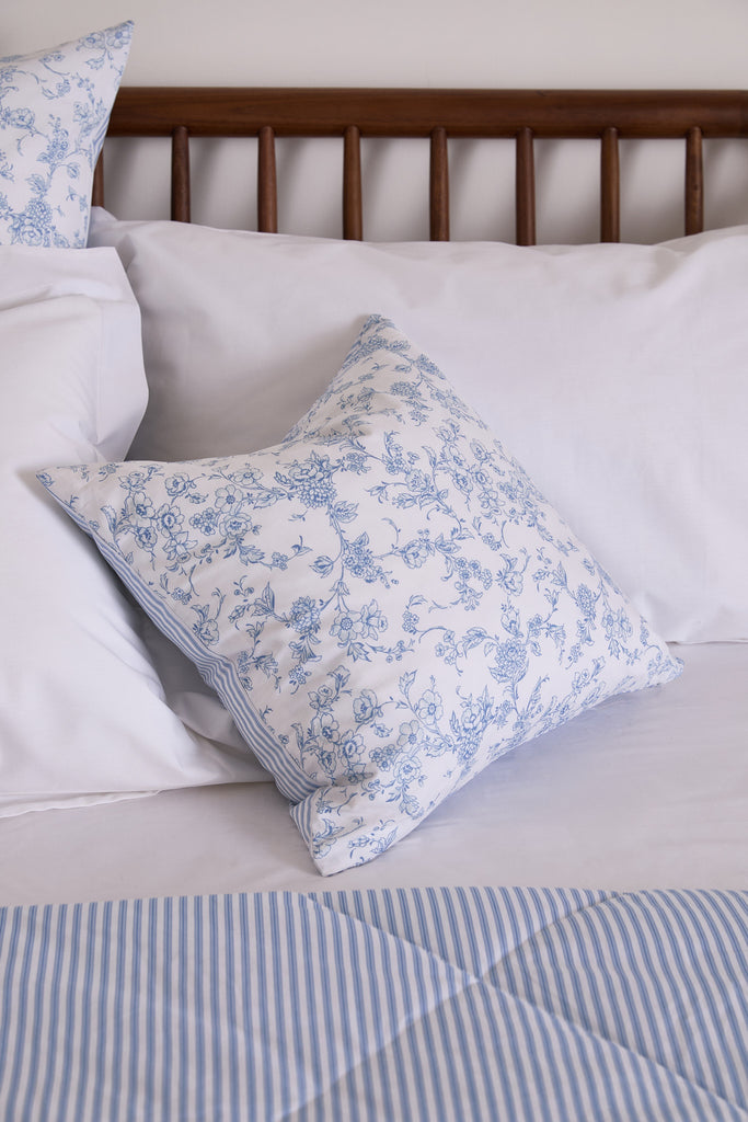 Experience true luxury with the Foxford Romantic Blossom print. This sophisticated cushion, created by renowned Irish designer Helen McAlinden, features a serene blue floral pattern that will elevate your bedding assortment. It is the latest addition to our 2024 summer collection, ensuring exceptional quality and comfort, as is customary with all our bedding products. Pair it with the Garden Bouquet Duvet Set and Quilted Blanket for an impeccable bedding ensemble.