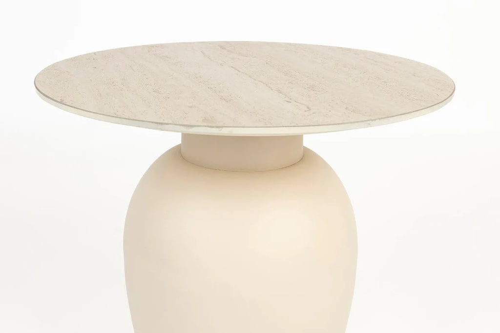 Foxford Casa Side Table - Short is a harmonious blend of natural design elements. Its ceramic tabletop boasts a beautiful travertine look, harmonizing effortlessly with the metal base. The soothing beige hue and organic round shape make this series a perfect addition to your living space.