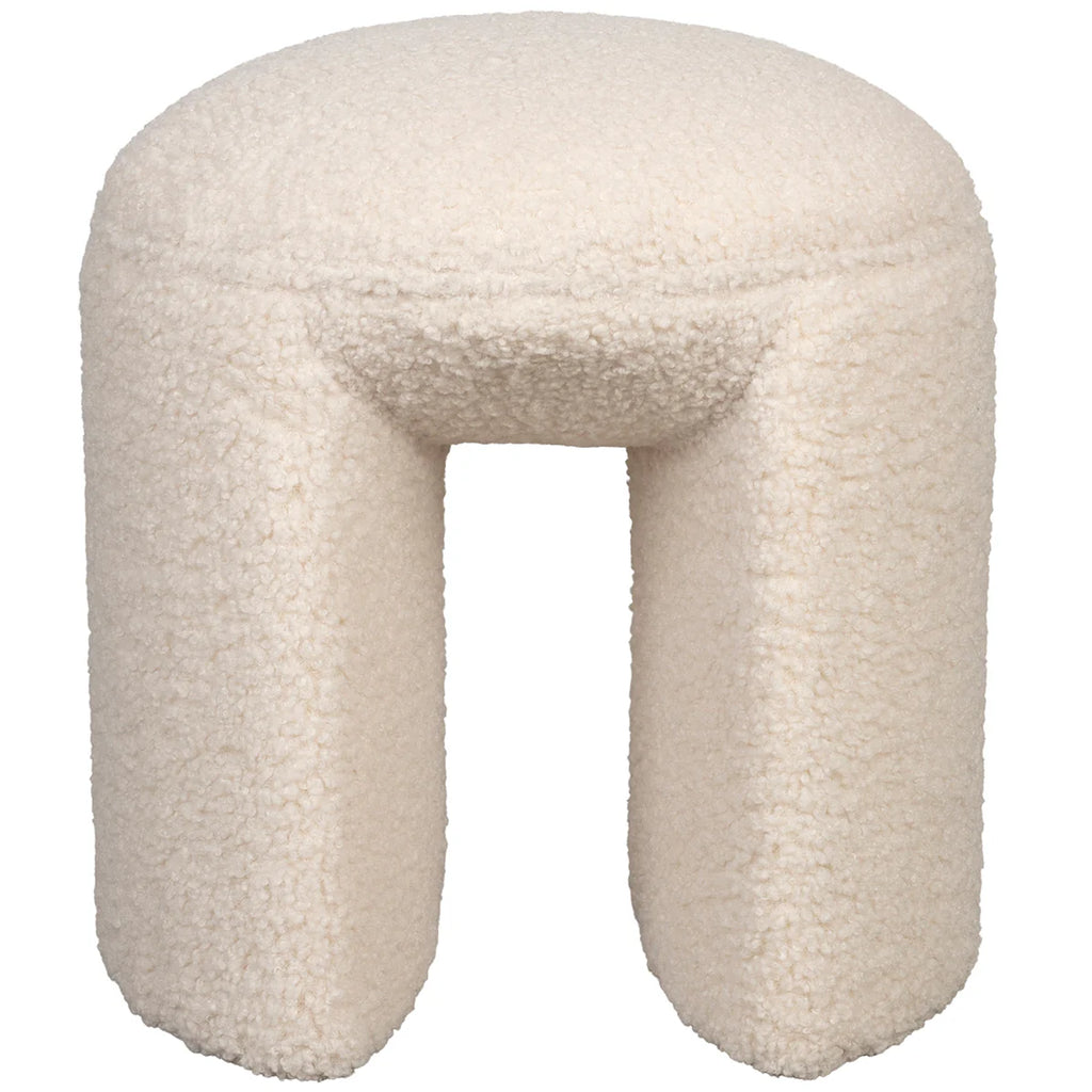 The Foxford Cloud Bouclé Stool offers a seamless combination of both comfort and style. Its trendy and chic design is sure to elevate any living space. With its crisp white bouclé upholstery, also known as teddy fabric, this stool exudes elegance. The foam seat ensures a comfortable sitting experience, making it the perfect spot to unwind and relax. Its organic contours and light appearance make it effortless to move as needed, providing an extra touch of convenience to any room.