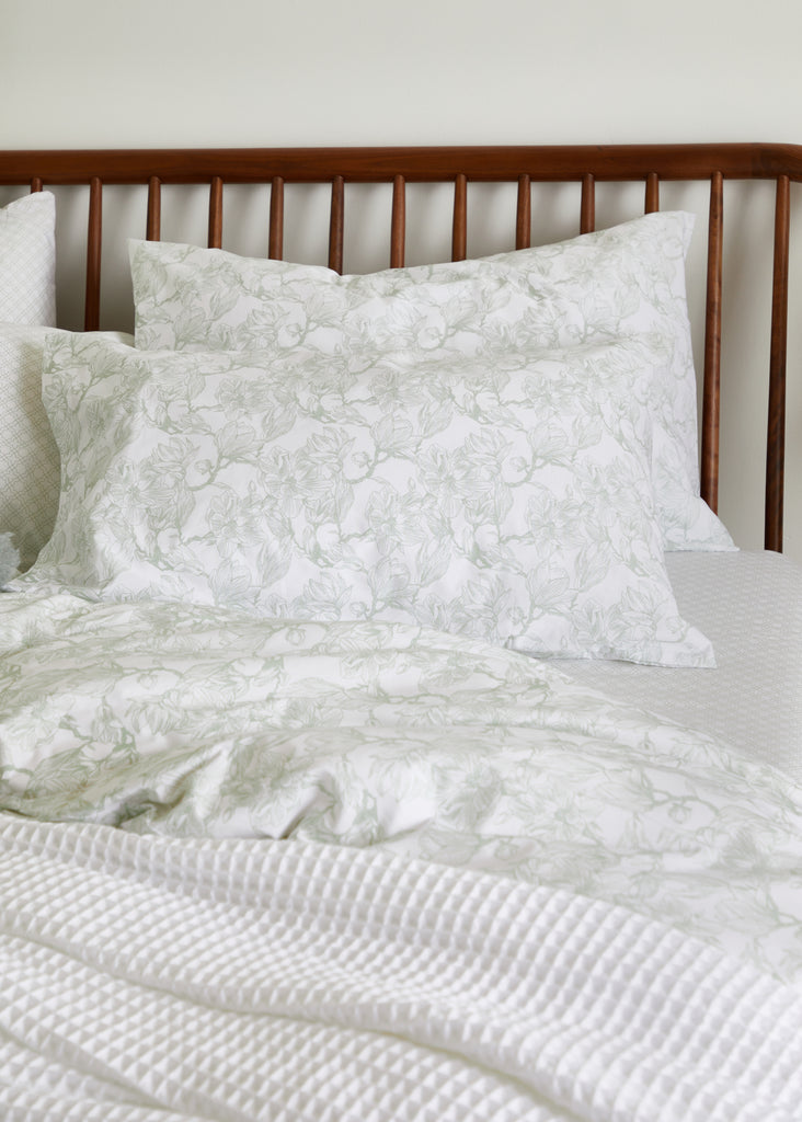 Crafted from 100% cotton, the Foxford Sage Magnolia Pillowcase Set features a serene magnolia pattern that brings elegance to any space. Its luxurious fabric ensures a comfortable and revitalizing sleep. The set includes two pillowcases.