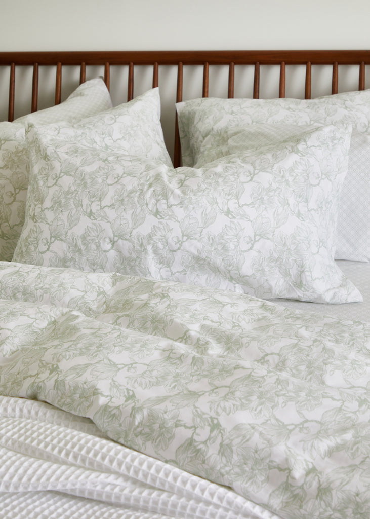 Elevate your bedroom with the Foxford Sage Magnolia King Pillowcase. Crafted from 100% cotton, this pillowcase features a serene sage magnolia pattern that adds a touch of elegance to any decor. Its luxurious texture ensures a comfortable and restful night's sleep. Perfectly sized for king pillows, this pillowcase combines style and comfort for a truly sophisticated bedding experience.