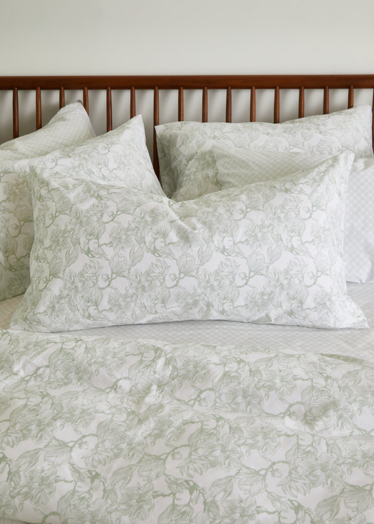 Elevate your bedroom with the Foxford Sage Magnolia King Pillowcase. Crafted from 100% cotton, this pillowcase features a serene sage magnolia pattern that adds a touch of elegance to any decor. Its luxurious texture ensures a comfortable and restful night's sleep. Perfectly sized for king pillows, this pillowcase combines style and comfort for a truly sophisticated bedding experience.