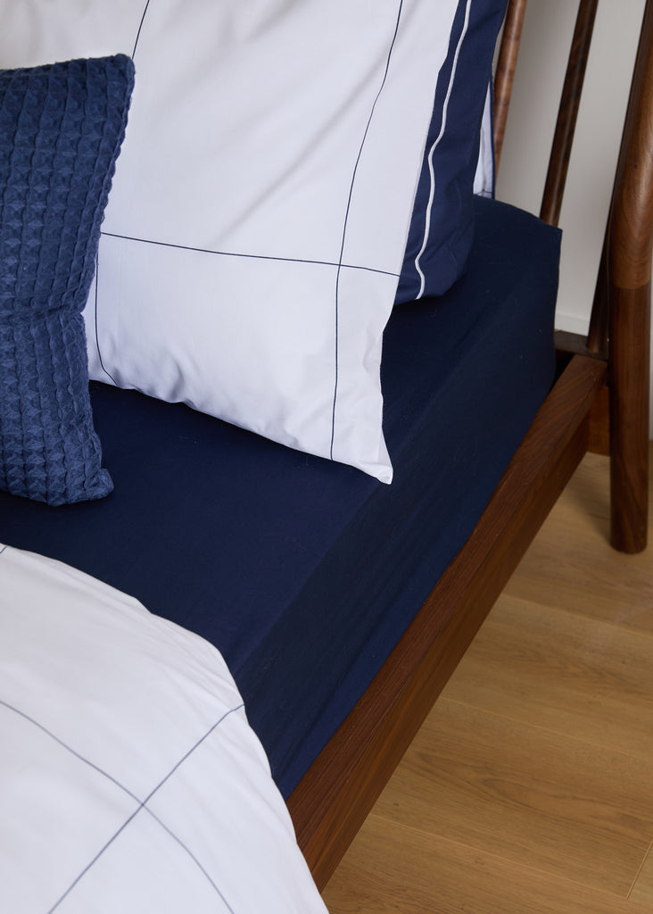 Expertly crafted in Portugal with 100% cotton, the Foxford Navy Fitted Sheet guarantees a comfortable and luxurious night's sleep. Designed in Ireland to match our duvet sets perfectly, this navy sheet features deep pockets for added convenience.