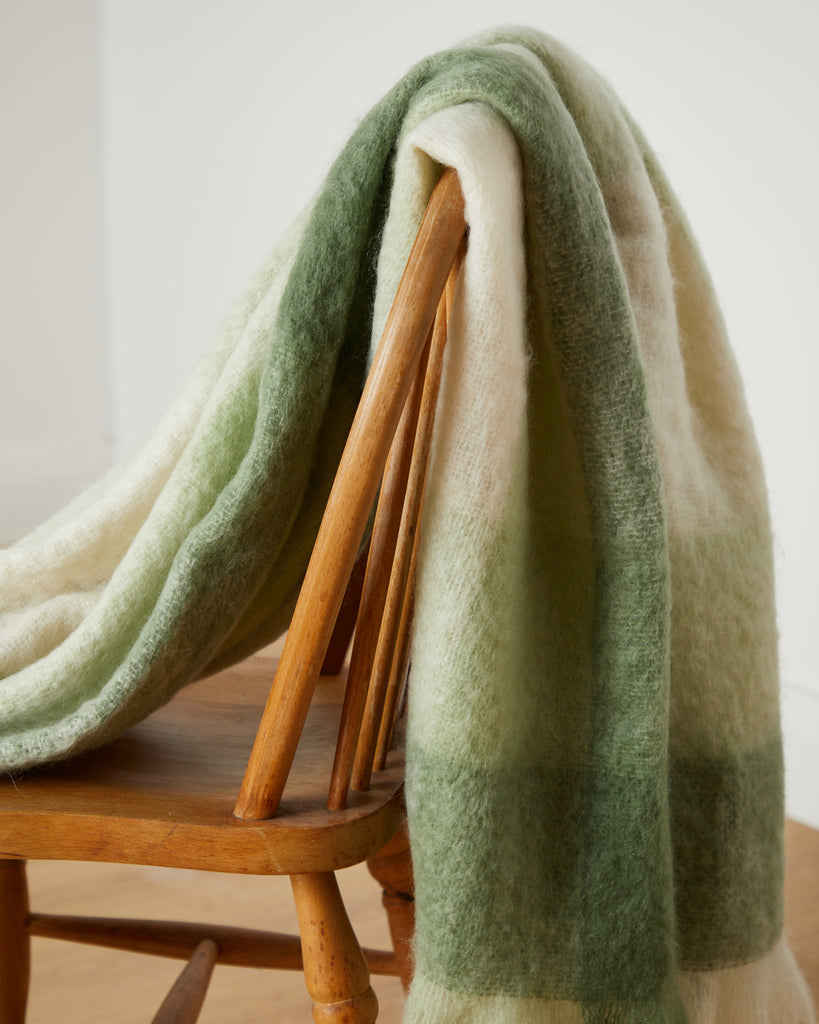 Foxford Newgrange Mohair Throw draped over chair