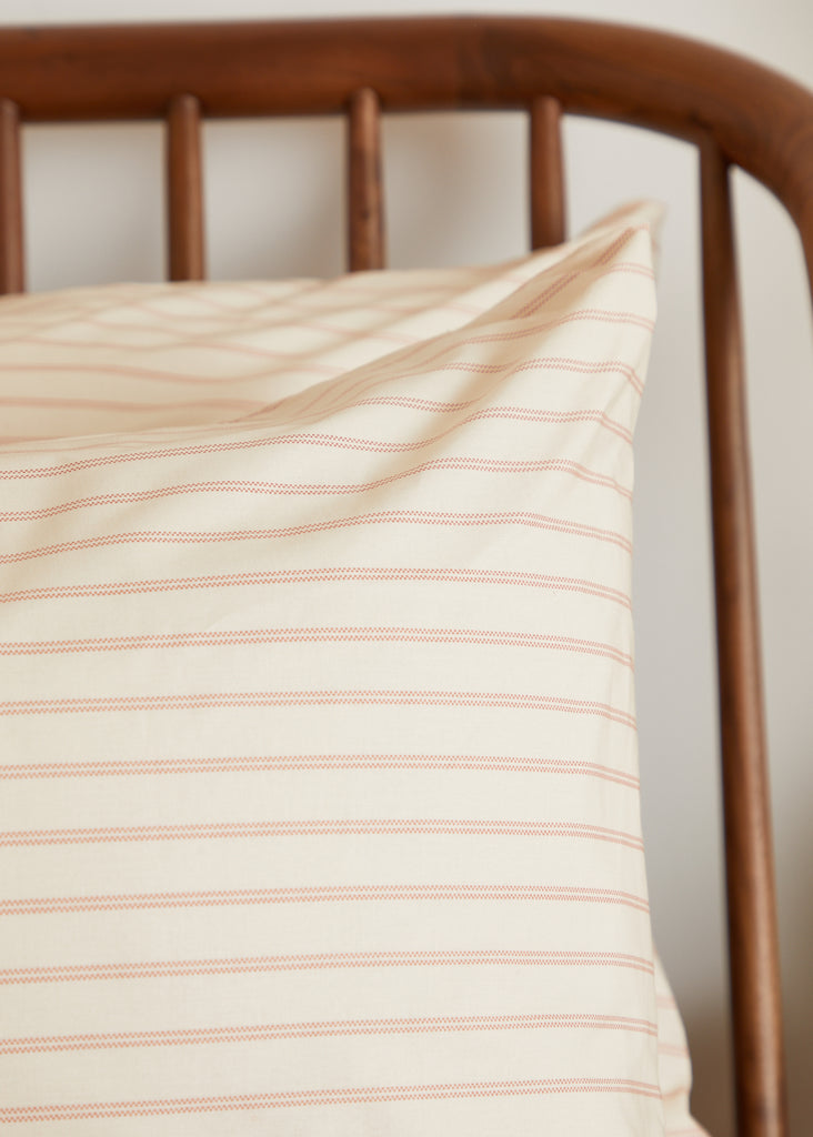 Introduce pure luxury with the Foxford Romantic Stripe Pair of Standard Pillowcases, part of our 180-thread count Everyday Collection. New for summer 2024, they feature a beautiful ticking pattern in peach and pink hues. Meticulously made in Portugal with 100% long-staple cotton and designed by acclaimed Irish designer Helen McAlinden, it guarantees the opulent cosiness and excellence of Irish bedding.