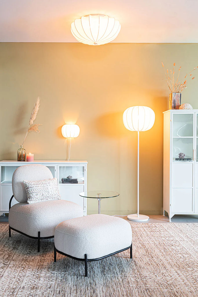 Take a bold leap in your home decor with the Foxford Shannon Floor Lamp! Standing tall at 160cm and boasting a 45cm diameter, this unique piece will make a daring statement in any room. Featuring a warm and cozy glow from its textile shade (made of 85% polyester and 15% cotton), and a touch of industrial style from its white iron body and base, this lamp also adds a hint of coastal adventure with its white oyster shell design.