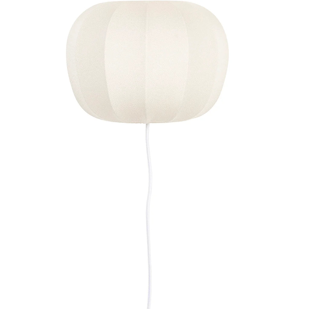 Take a bold leap in your home decor with theFoxford Shannon Wall Light, this unique piece will make a daring statement in any room. Featuring a warm and cozy glow from its textile shade (made of 85% polyester and 15% cotton), this lamp also adds a hint of coastal adventure with its white oyster shell design.