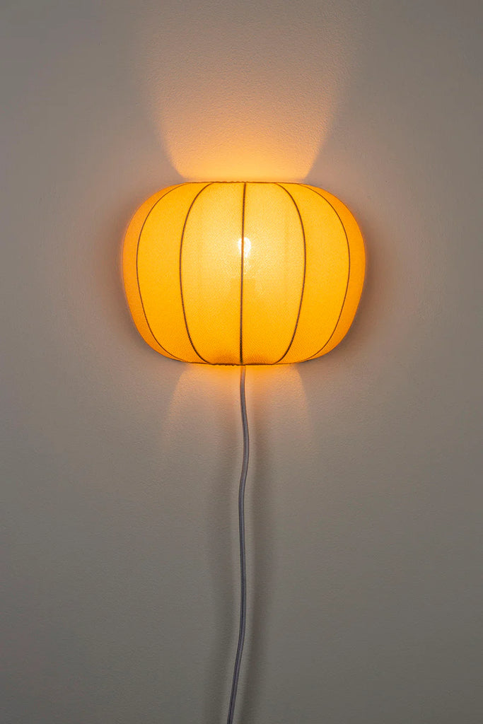 Take a bold leap in your home decor with theFoxford Shannon Wall Light, this unique piece will make a daring statement in any room. Featuring a warm and cozy glow from its textile shade (made of 85% polyester and 15% cotton), this lamp also adds a hint of coastal adventure with its white oyster shell design.