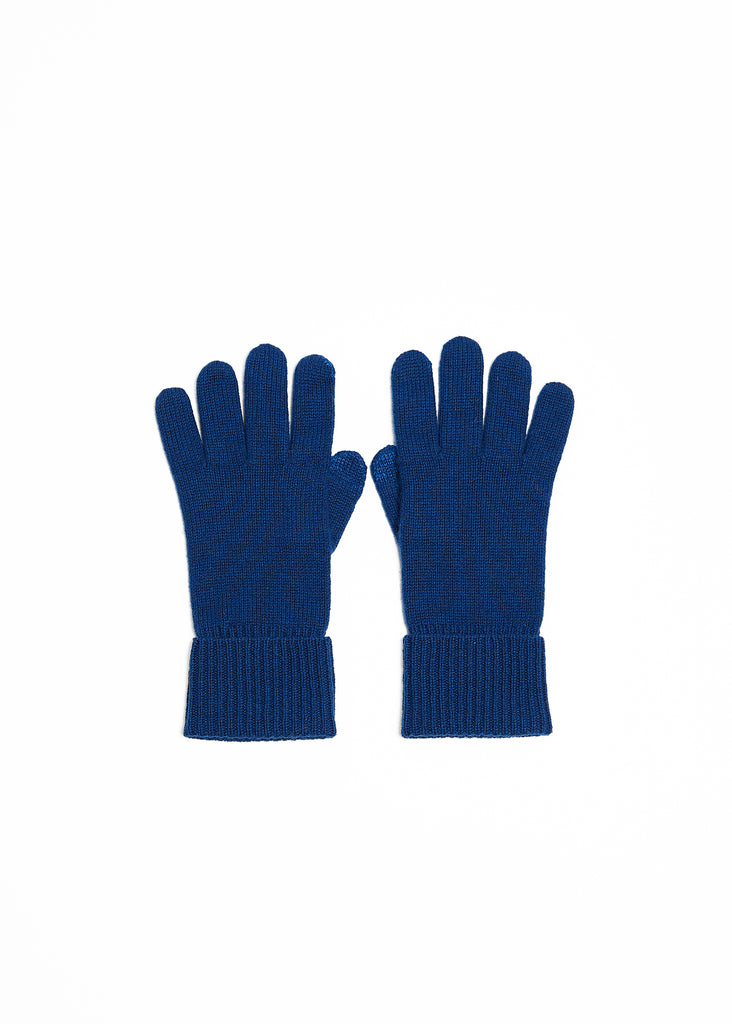 Our unisex navy gloves are crafted from 100% pure cashmere, featuring a ribbed cuff and providing the ultimate in cold-weather opulence. The insulating texture of cashmere will keep your hands warm and cozy, whether you're commuting to the office or exploring a winter wonderland. These gloves will elevate your style while keeping you comfortably shielded from the cold.  Foxford Navy Cashmere Gloves made with conductive thread on the index finger and thumb, allowing for ease of messaging while maintaining a 