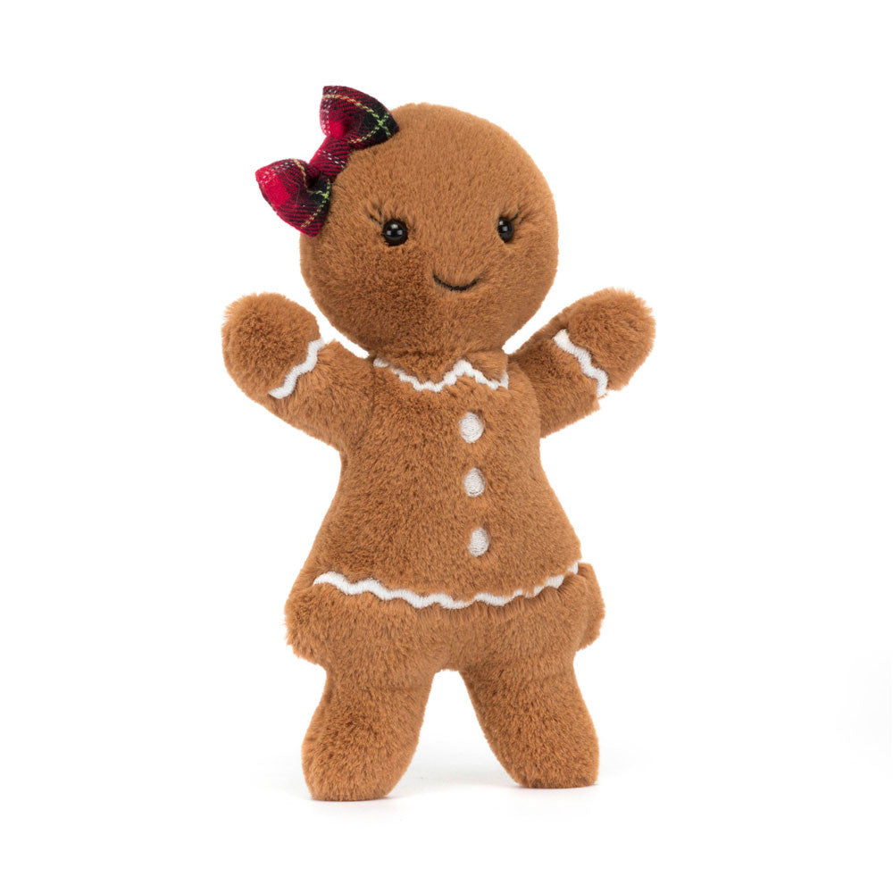 Jolly Gingerbread Ruby can't wait for Christmas! She's all glammed up in a stitched icing dress and her cosy fur is baked to perfection. With embroidered lashes and a tartan hair bow, and biscuit arms aloft, Ruby shines!