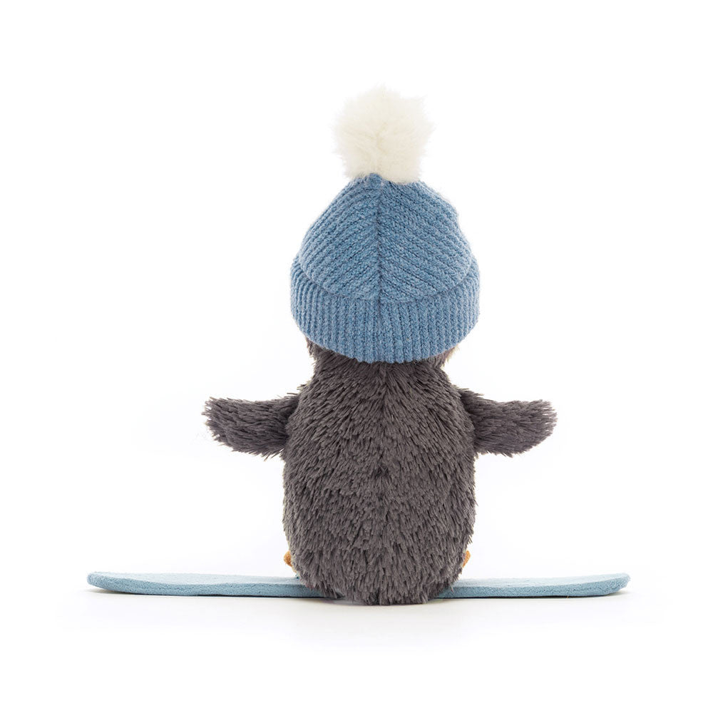 Peanut Penguin Snowboarding is ready to wobble down the slopes! Lovably soft in blue-grey fur, with a cream tummy, little flippers and orange beak and feet, our intrepid chick rides a blue suedette board. Wearing a cosy blue knitted hat with fluffy snowball pompom, this penguin's a gorgeous good-luck charm.