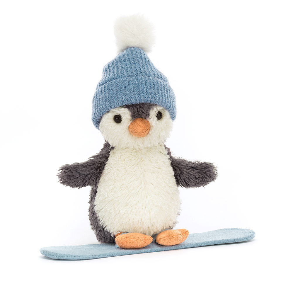 Peanut Penguin Snowboarding is ready to wobble down the slopes! Lovably soft in blue-grey fur, with a cream tummy, little flippers and orange beak and feet, our intrepid chick rides a blue suedette board. Wearing a cosy blue knitted hat with fluffy snowball pompom, this penguin's a gorgeous good-luck charm.